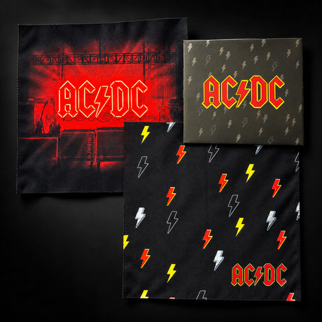 AC/DC Cleaning Cloth 2-Pack - both printed microfibre cloths shown with the branded AC/DC lightning bolt envelope