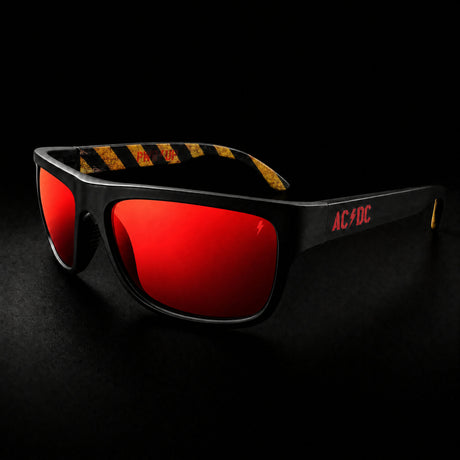 AC/DC PWR UP sunglasses, red chrome mirror lens, front three-quarter view with AC/DC logo on the temple